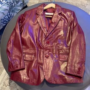 Beautiful dark red leather jacket. lightly worn, No rips, tears or worn marks.